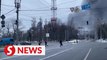 Russia bombards Ukraine cities, armored convoy stalls