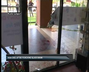 Man dies after punching glass door