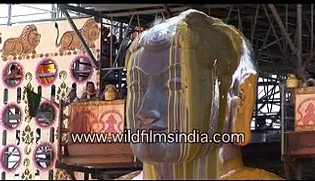 Haldi or turmeric poured over Bahubali at Shravanabelagola