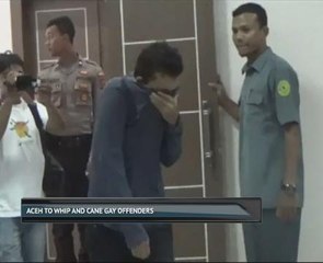 Aceh to whip and cane gay offenders