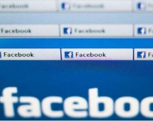Facebook warns again on ad growth, shares dip from high