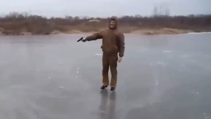 Watch What Happens When This Man Fires A Gun At A Frozen Lake