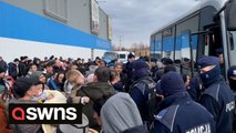 Tensions high as refugees from Uzbekistan attempt to board bus taking them to the airport after being evacuated from Ukraine