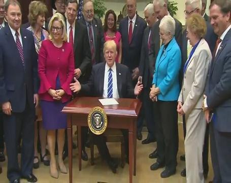 Donald Trump signs four bills rolling back Obama-era rules