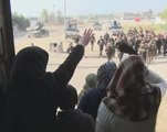 Iraqis in liberated Mosul district wave white flags