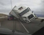 Caught on camera: Semi truck blows over in wind storm
