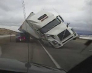Caught on camera: Semi truck blows over in wind storm