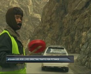 Afghan kids risk lives directing traffic for pittance