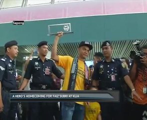 A hero's homecoming for Faiz Subri at KLIA