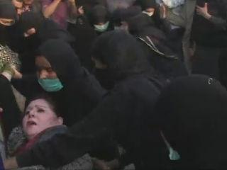 Pakistan police clash with female anti-government protesters
