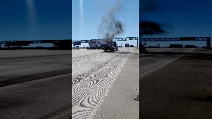 Fireman Extinguish Car That Caught Fire on Tow Truck