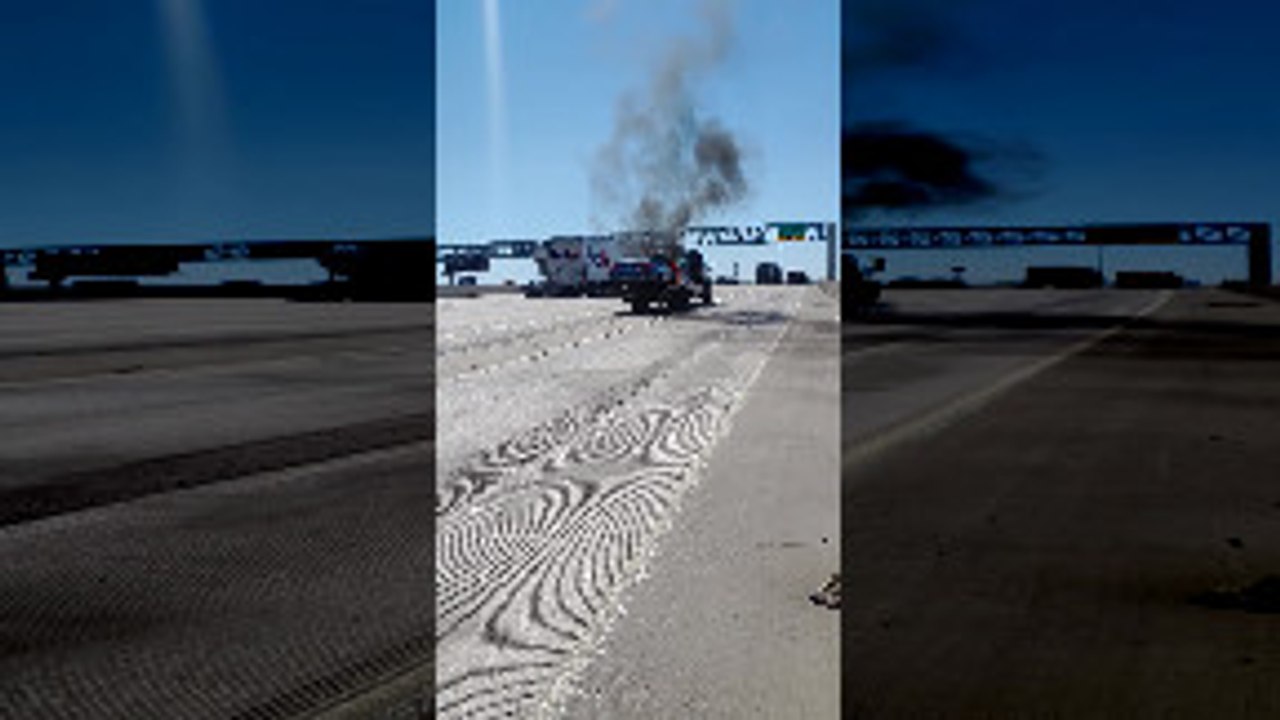 Fireman Extinguish Car That Caught Fire on Tow Truck