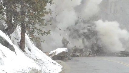 Crews dynamite large boulder blocking highway