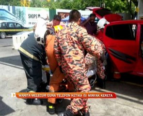 Wanita melecur guna telefon ketika isi minyak kereta