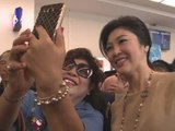 Thai ex-PM Yingluck Shinawatra defies army with selfie and smiles tour