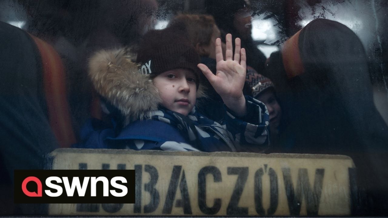 Ukrainian refugees wait for further transport after arriving across the border to Medyka, Poland