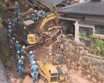 Rescuers race against landslides to reach Japan quake victims