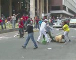 Venezuelan opposition and Chavistas clash in Caracas