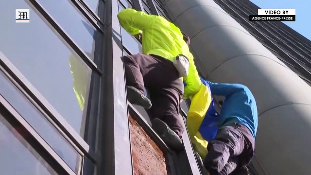Urban climbers scale Paris' highest tower to show solidarity with Ukraine