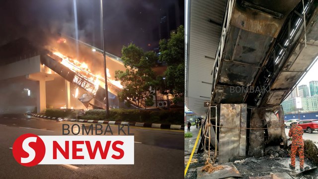 Escalator linked to a pedestrian bridge to cross Jalan Ampang caught fire