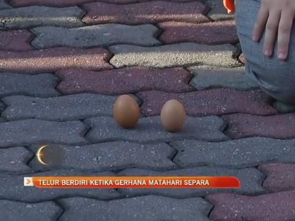 Telur berdiri ketika gerhana matahari separa