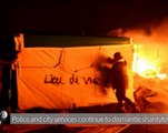 Activists,migrants try to salvage shacks at Calais 'Jungle' camp