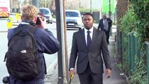 Dizzee Rascal jokes with press as he arrives at court