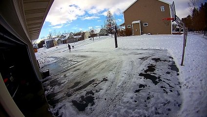 Woman Slips on Black Ice in Front of Garage