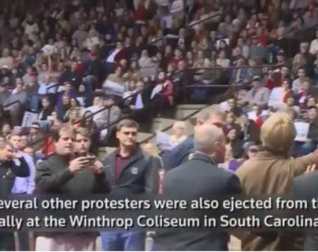 Woman in Muslim headscarf ejected from Trump rally