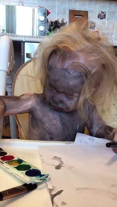 Child Covered in Paint