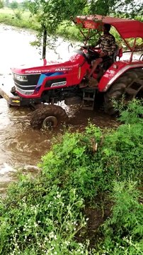 Mahindra Arjun novo 605 DI-I performance with 11 tones cultivator in mud field for paddy