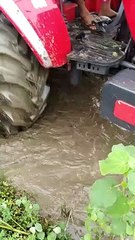 Mahindra Arjun Novo 605 with rotavator in water field
