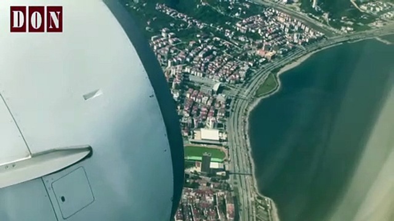 View From An Airplane Window Flying Above The Clouds