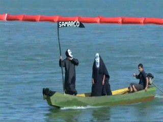 Fishermen bury fish washed up in mining mudflow