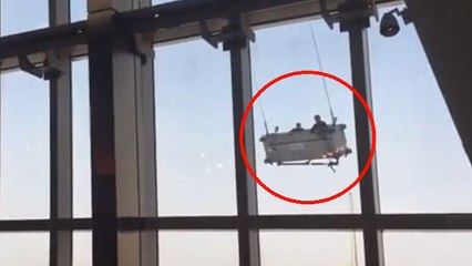 Secoués par le vent, ces laveurs de vitre chinois ont connu la peur de leur vie