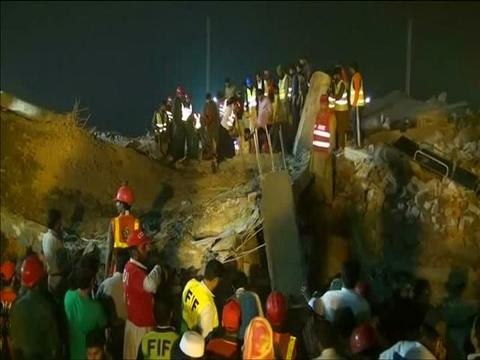 Scores trapped in deadly Pakistan factory collapse