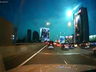 Green fireball seen falling across Bangkok night sky