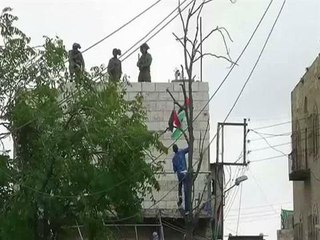 Stun grenades and tear gas scatter Palestinian protesters