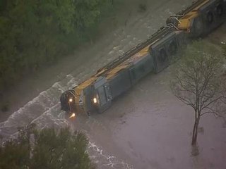 Flash floods overturn train, close roads in Texas