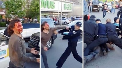 Vyacheslav Oliynyk, médaillé d'or en lutte aux JO d'Atlanta, se bat avec une horde de policiers