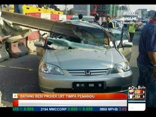 Batang besi projek LRT timpa kereta