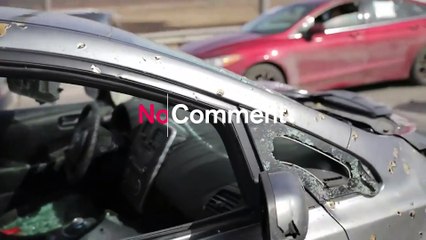 Cars left on partially destroyed Irpin bridge following attacks