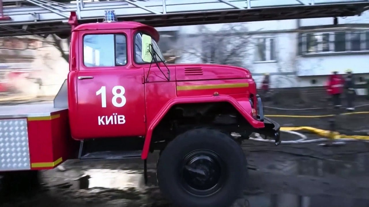 Ukrainian firefighters rescue trapped civilians from burning Kyiv apartment block after Russian shelling
