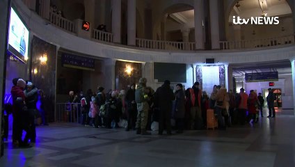 Women and children flee the port of Odesa, Ukraine