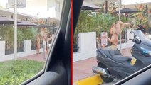 Tanga bikinisiyle sokakta direk dansı yapan kadın, sürücüleri hayretler içerisinde bıraktı