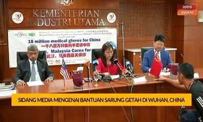 Sidang media mengenai bantuan sarung getah di Wuhan, China