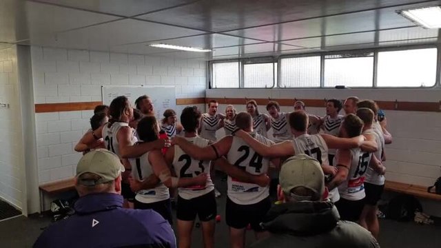 Burnie Dockers sing the club song after defeating Wynyard