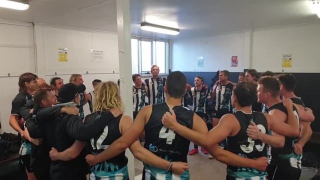 Devonport players celebrate their NWFL win over Wynyard