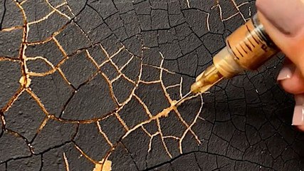 Artist injects liquid gold into textured resin artwork