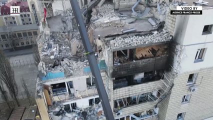 Ukrainian rescuers search wreckage of building hit by airstrike